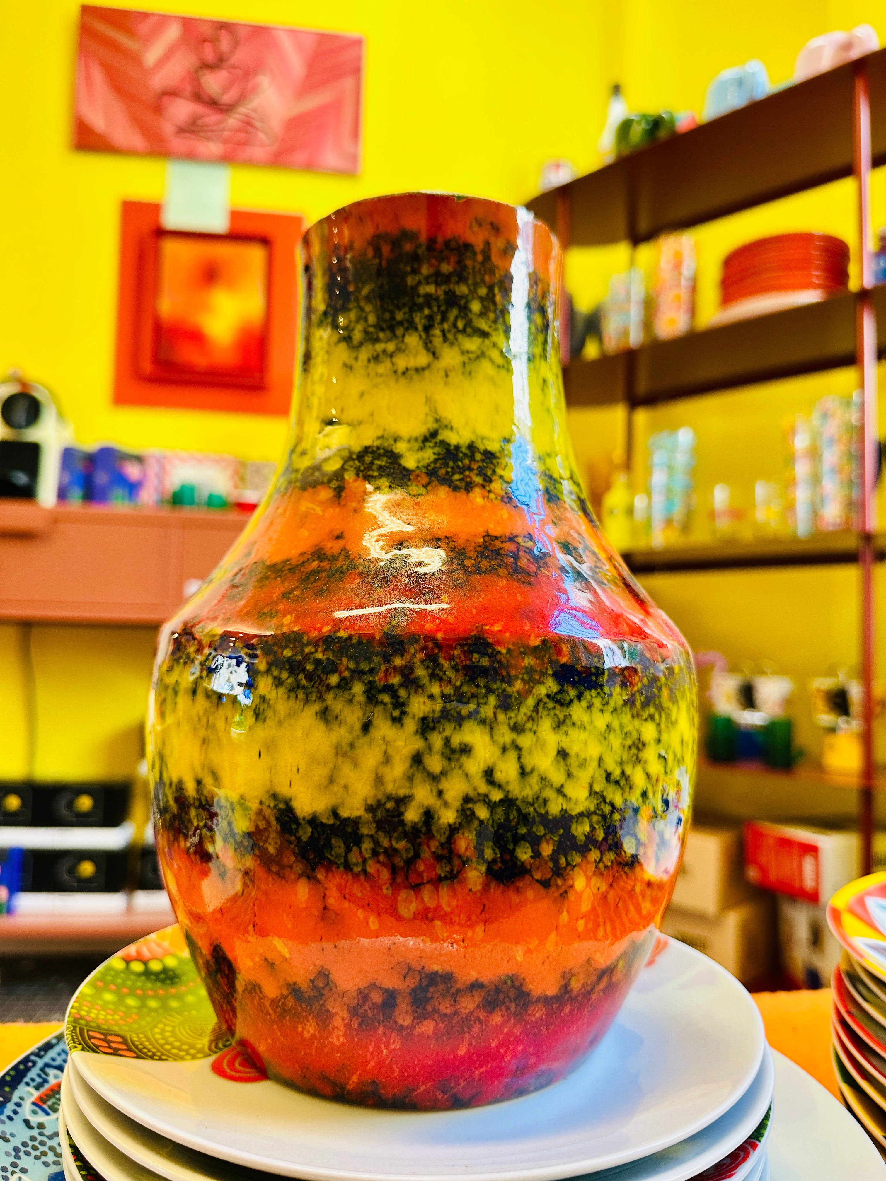 Multicolor vintage vase, predominantly orange.