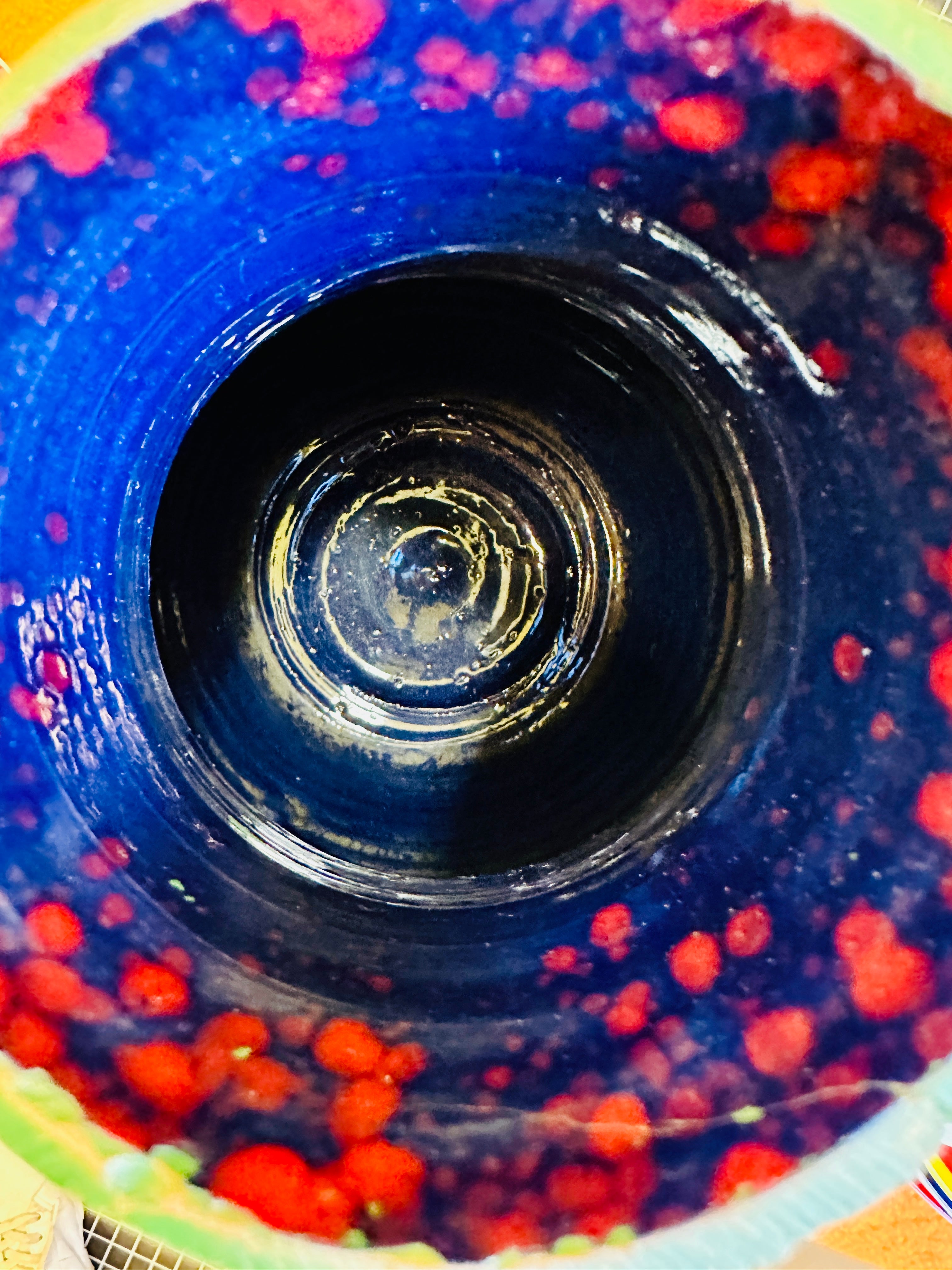 Multicolor vintage vase, predominantly orange.