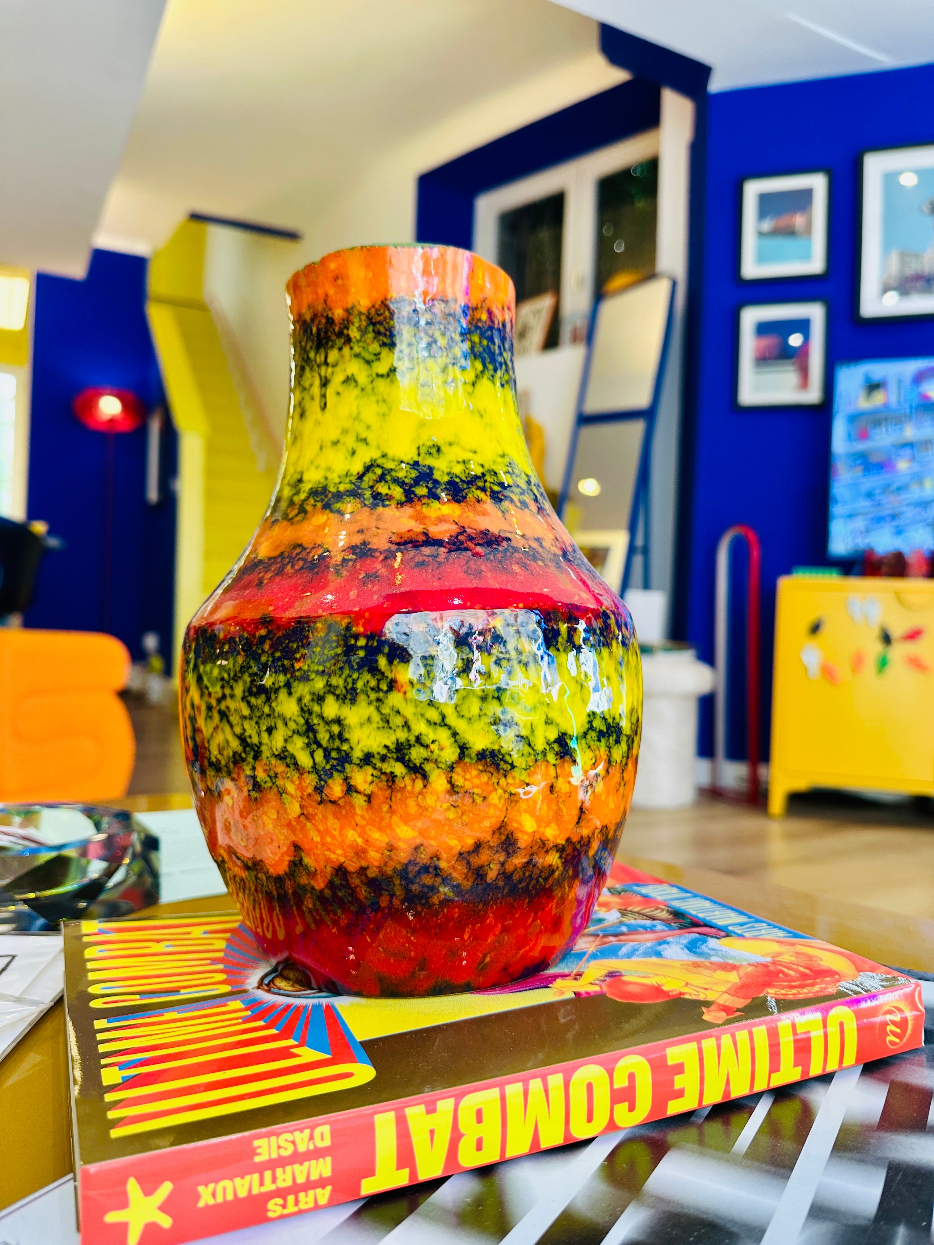 Multicolor vintage vase, predominantly orange.