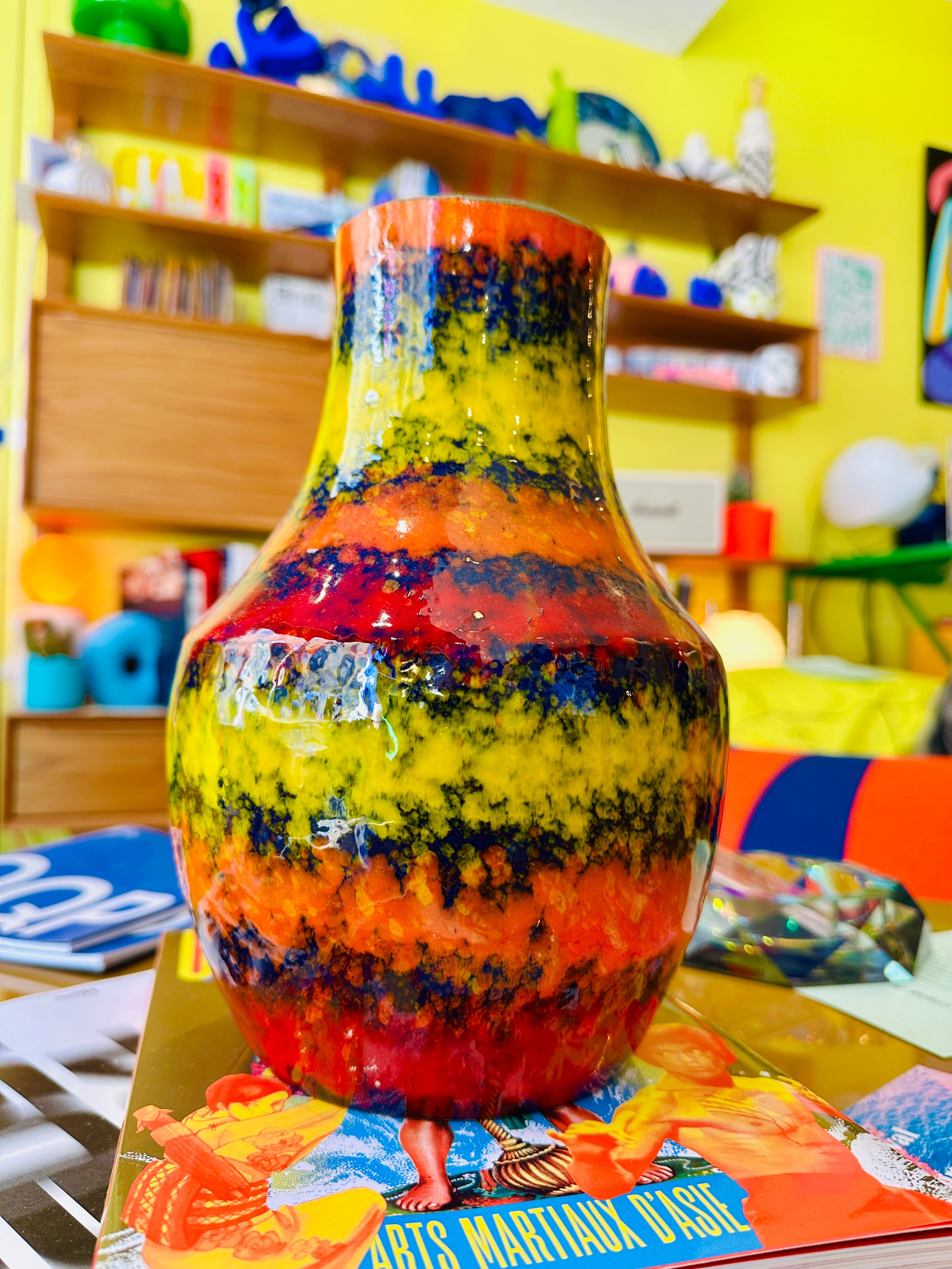 Multicolor vintage vase, predominantly orange.