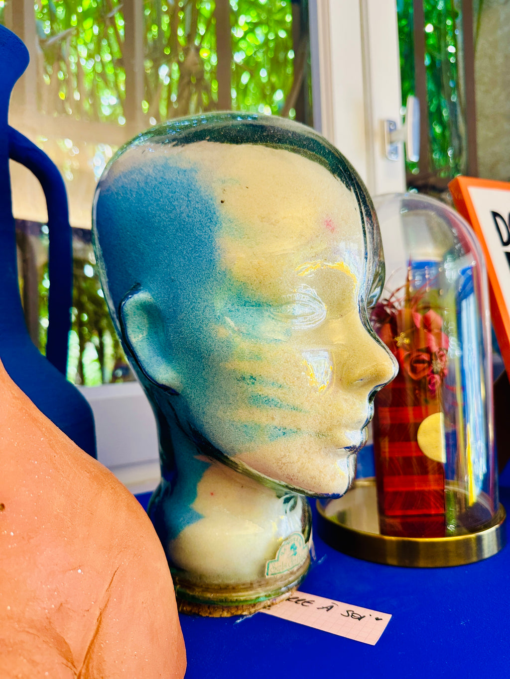 Tête en verre vintage "le verre à soi" contenant des sels de bain.