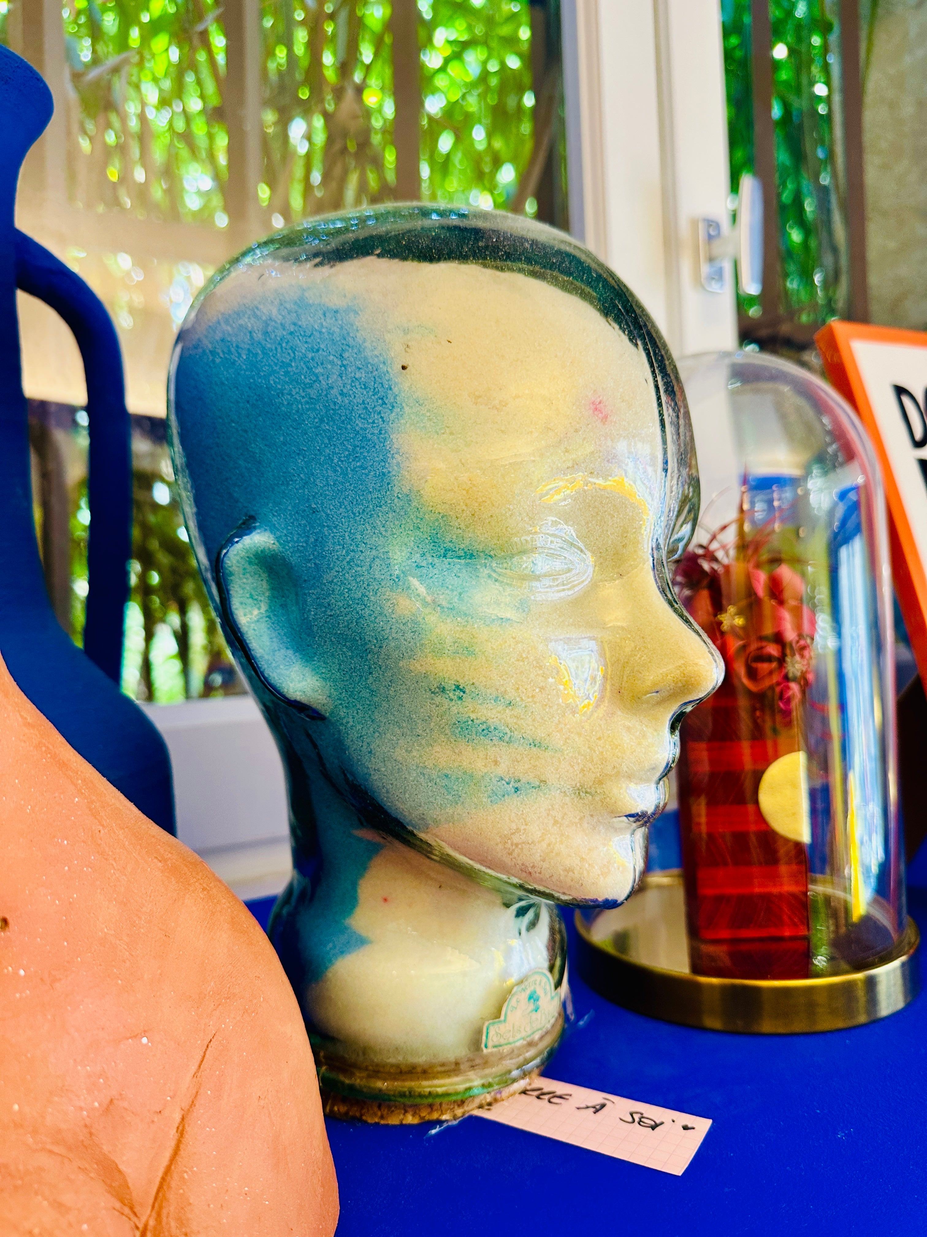 Tête en verre vintage "le verre à soi" contenant des sels de bain.