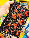 Pochette Vintage à fleurs en relief.